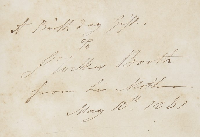 The inscription inside of a book given to John Wilkes Booth by his mother, Mary Ann Holmes Booth, on his birthday in 1861.